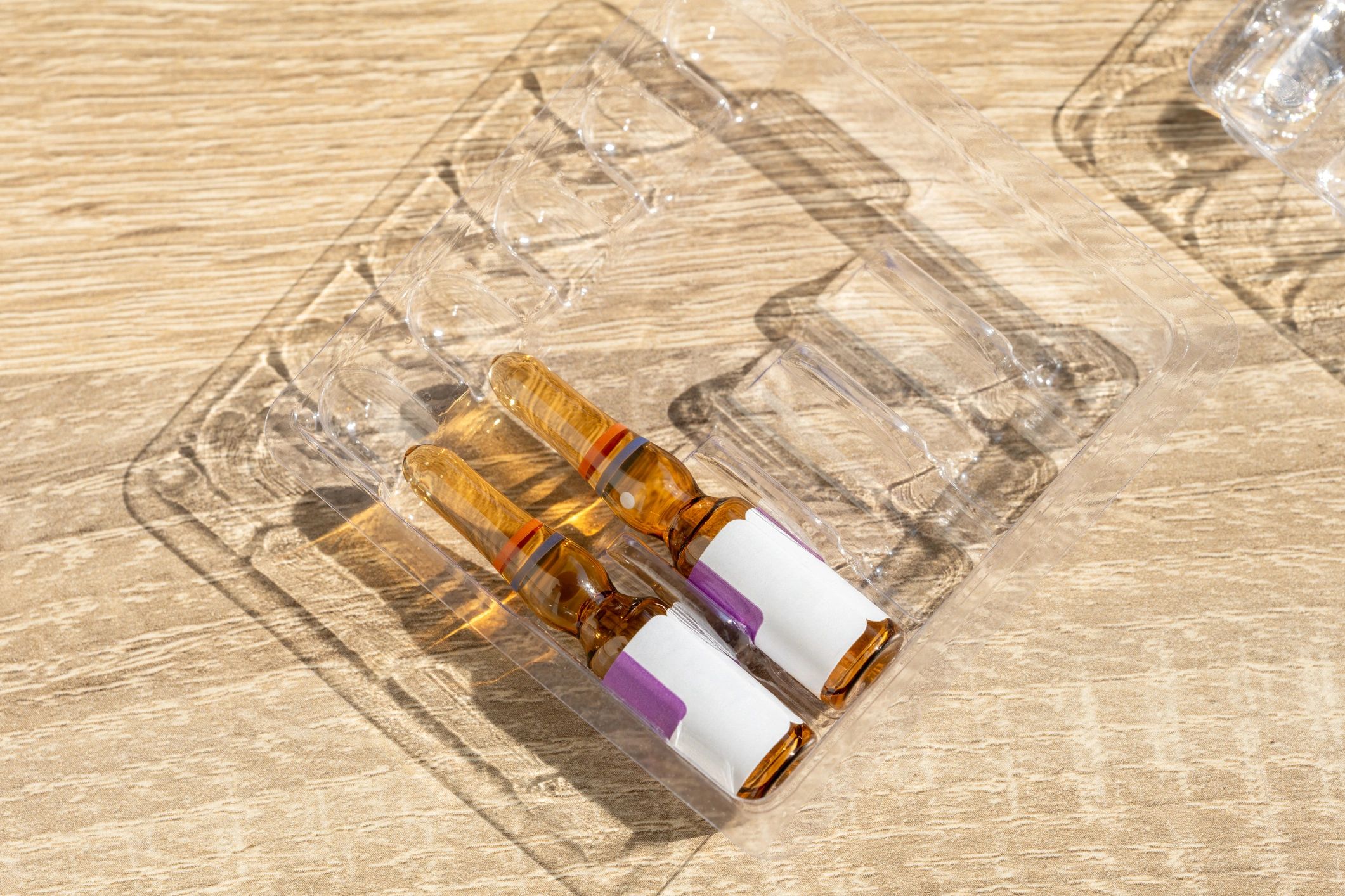 Medical ampoules in protective packaging representing healthcare supply quality and careful handling